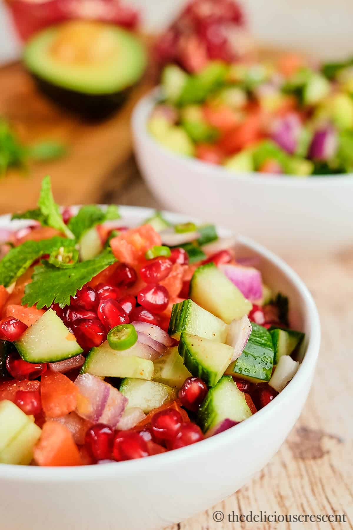Indian tomato cucumber salad with some pomegranate.