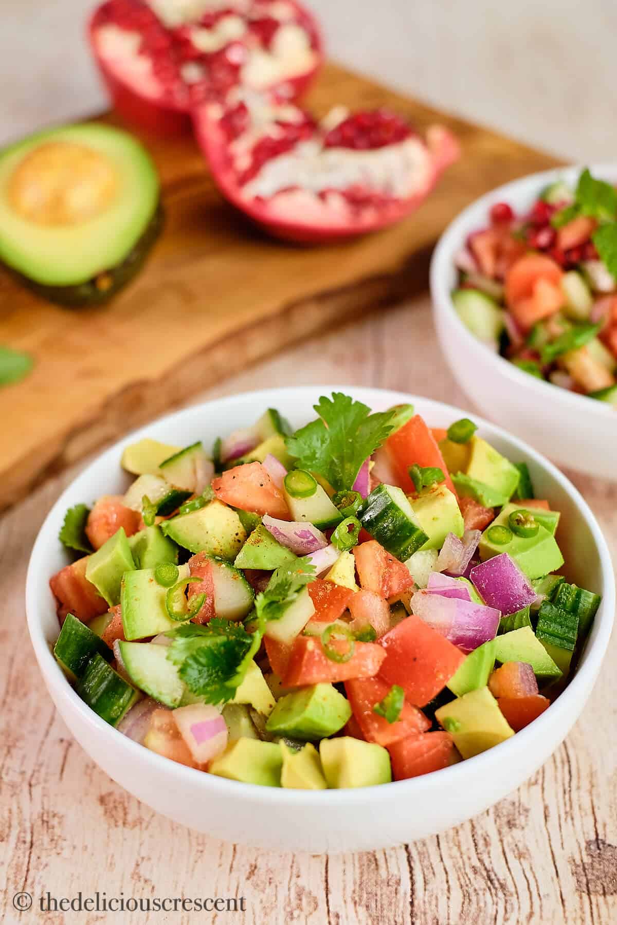 Indian kachumber salad in a bowl placed on the table.