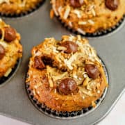 Close up view of muffins sweetened with dates and baked with toppings.