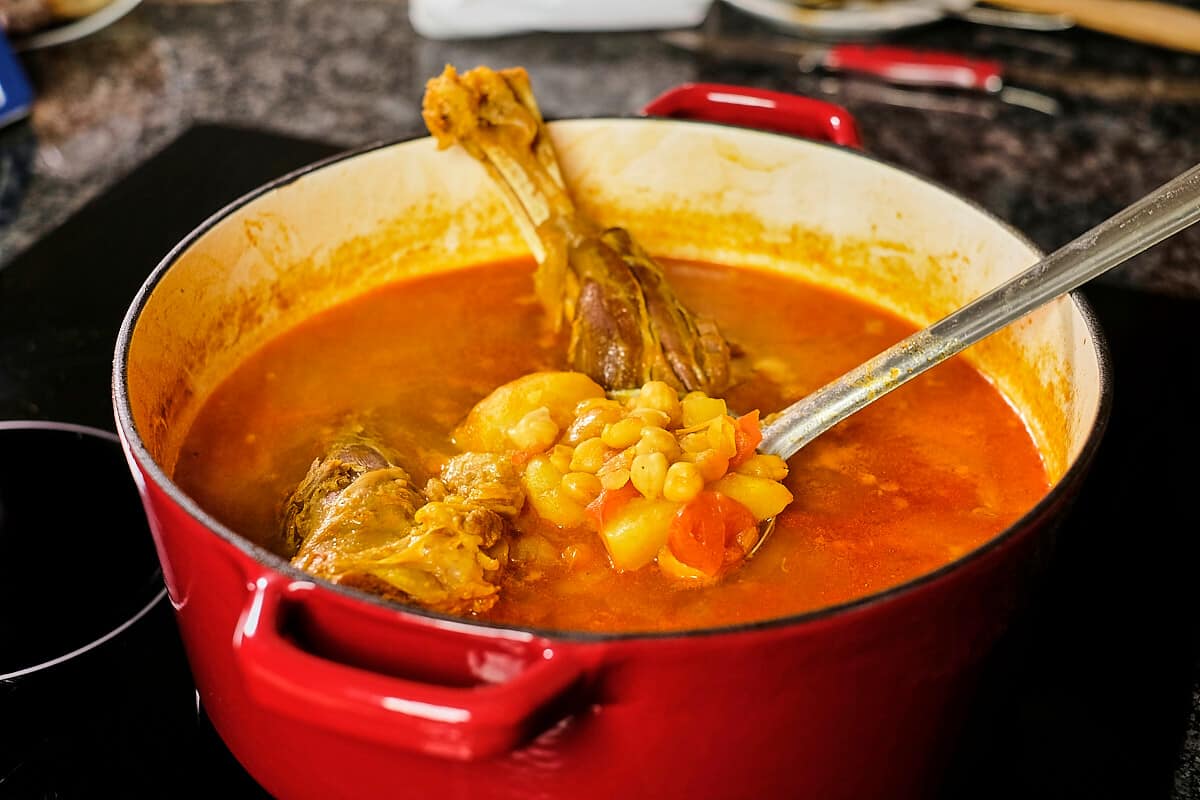 A pot of Persian lamb soup cooking.