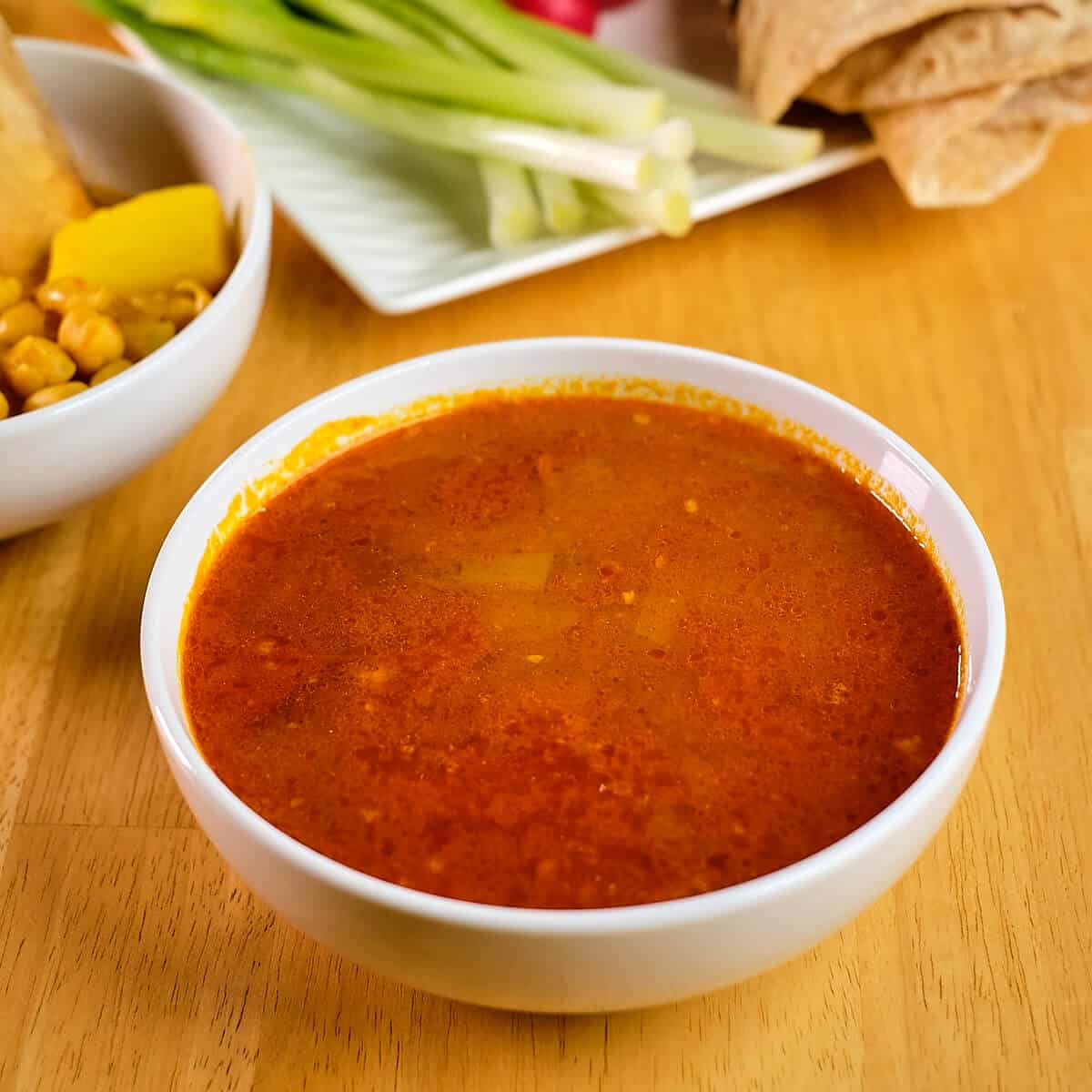 Persian meat broth served in a bowl to make tilit.