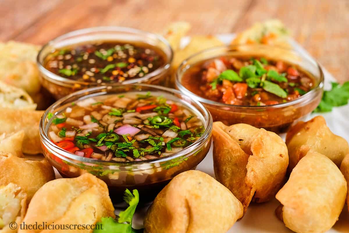 Three delicious tamarind sauces with appetizers.