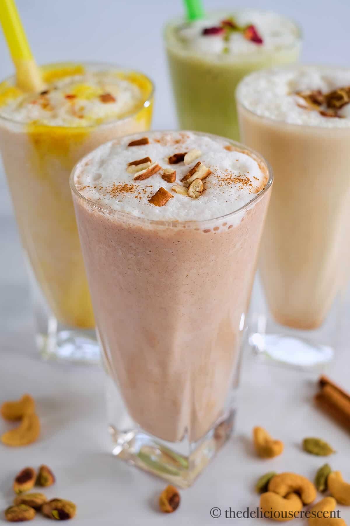 Assorted flavors of date shakes in glasses.