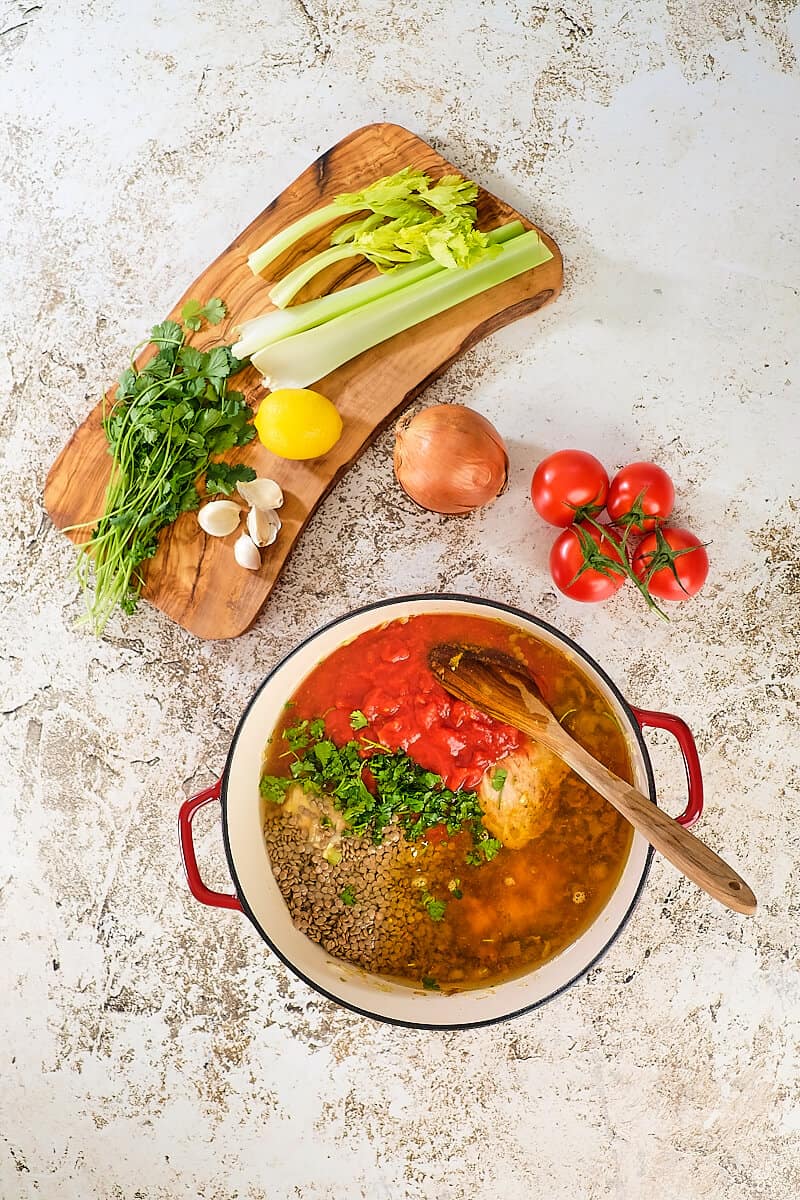 Tomatoes and lentils added to the soup.