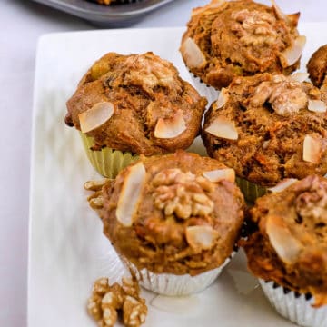 Close view of healthy carrot cake muffins on a platter.