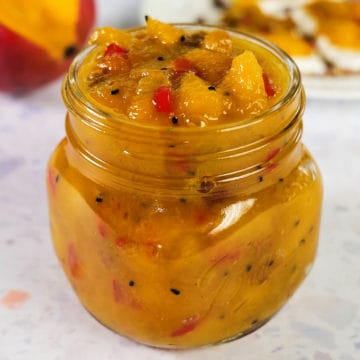 Close up view of mango chutney filled in a jar.