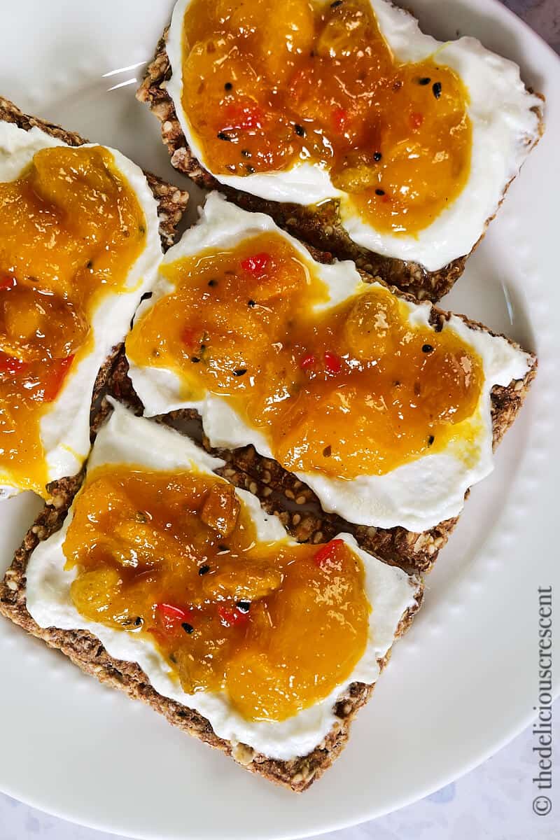 Savory preserves and cream cheese on crackers.