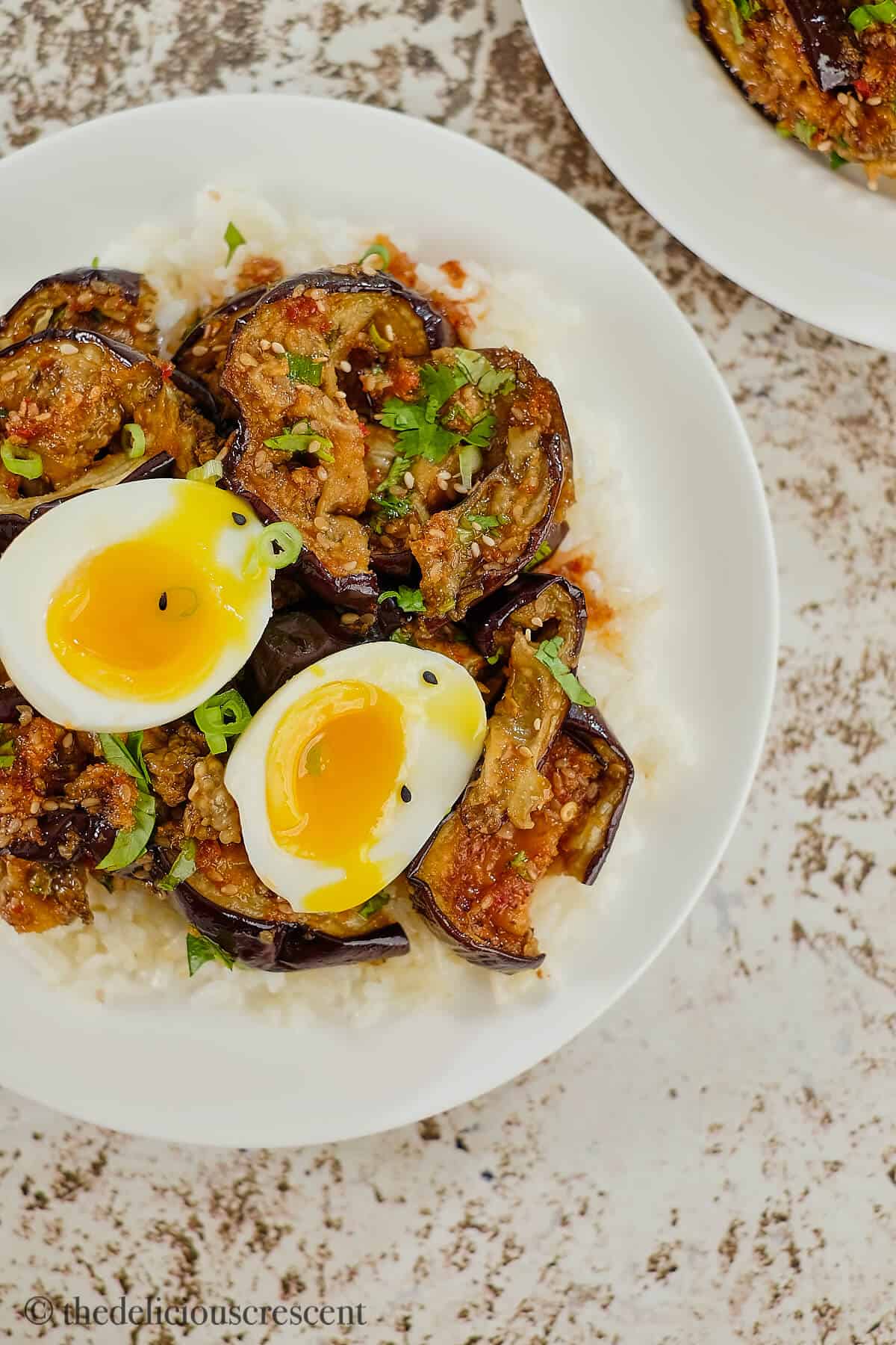 Roasted vegetables with soft boiled eggs on the top.