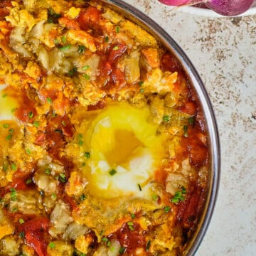 Close up view of mirza ghasemi, Persian eggplants eggs in a dish.