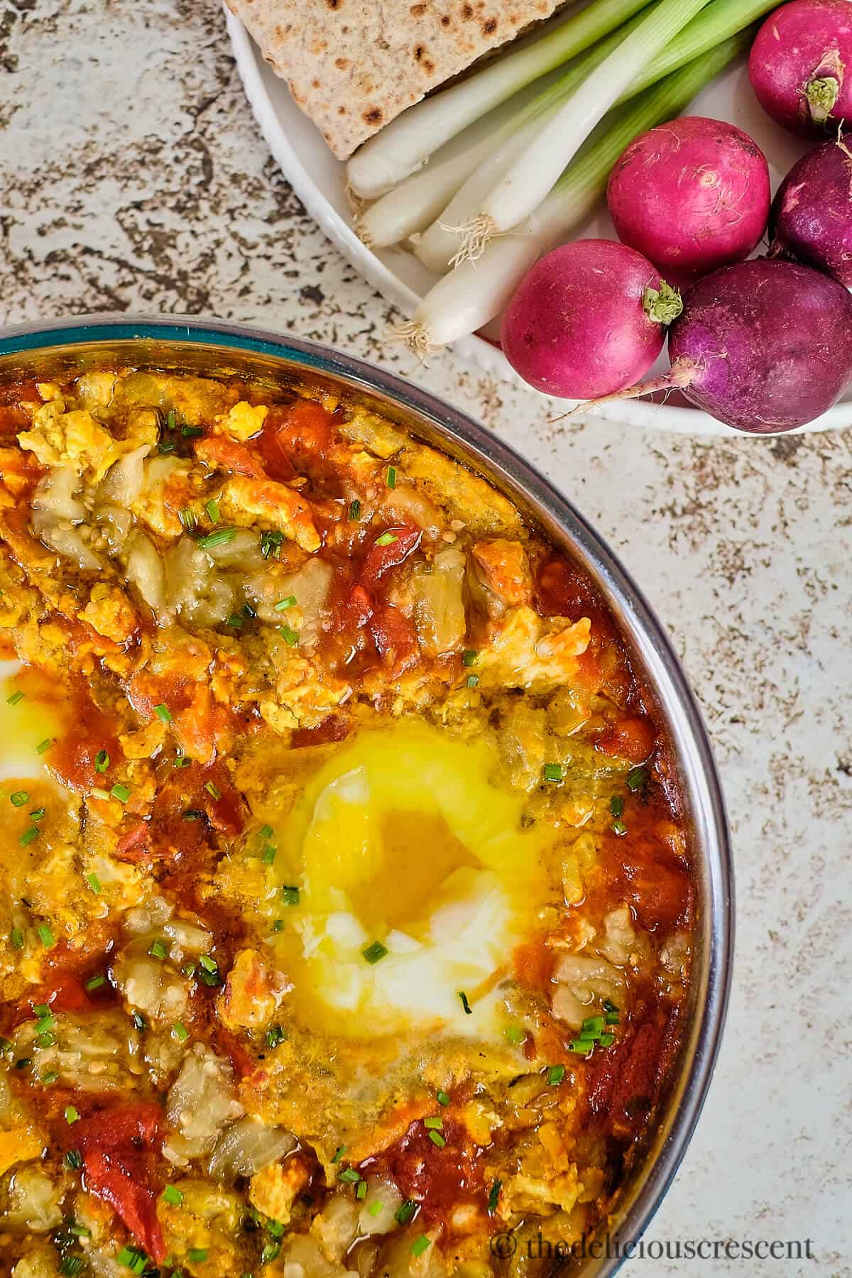 Eggplants with eggs in a dish.