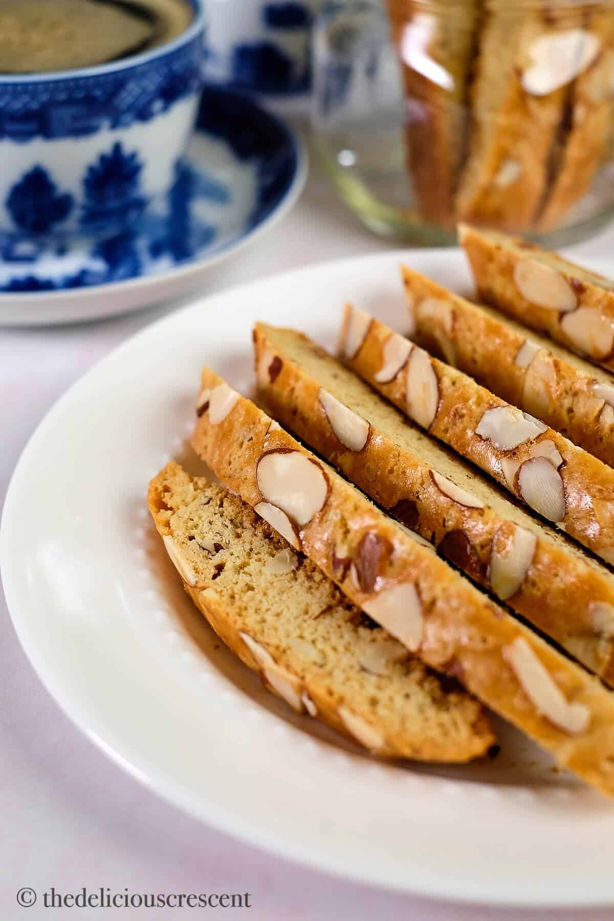 Almond biscotti served on a white plate.