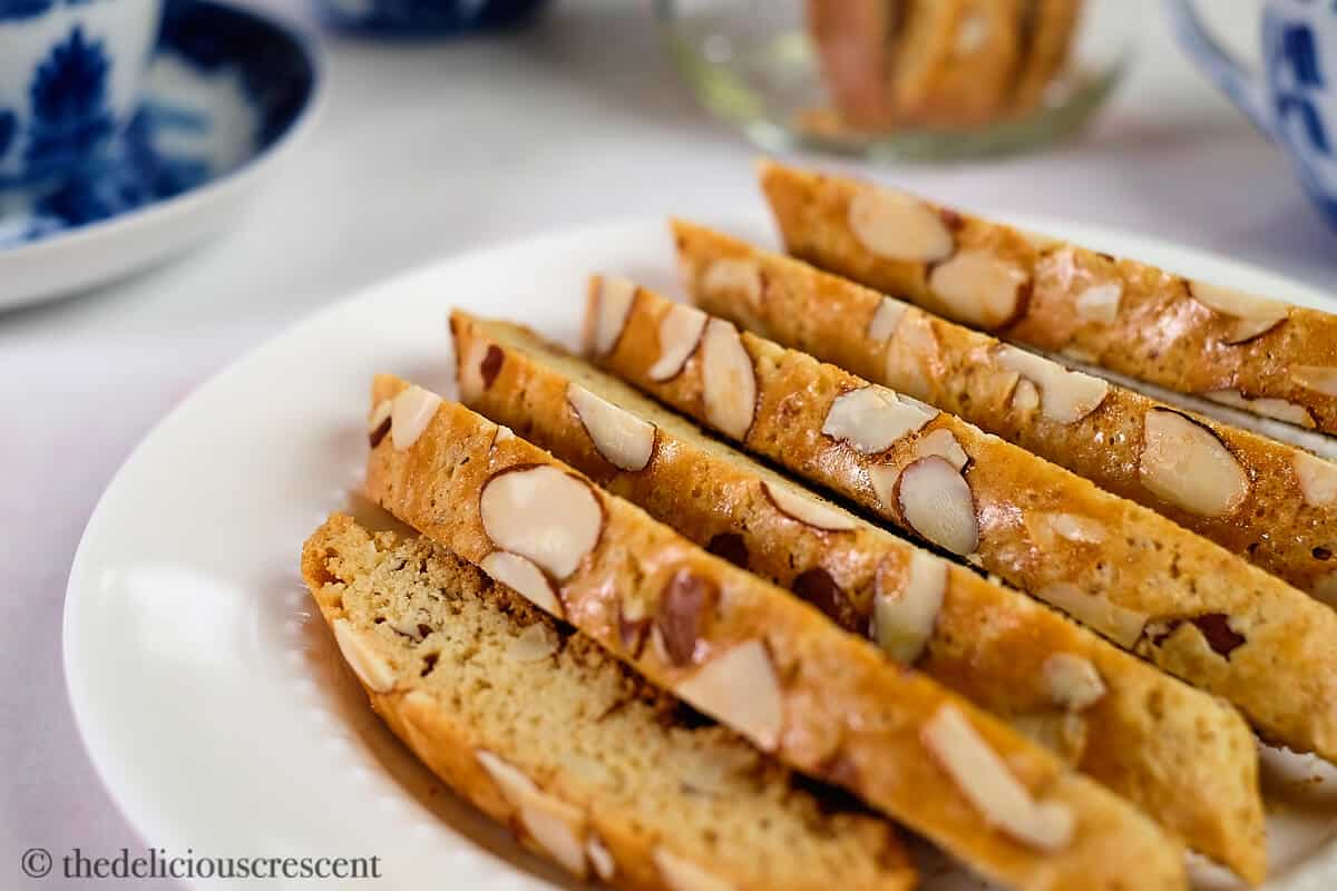 Several Italian cookies on a plate.