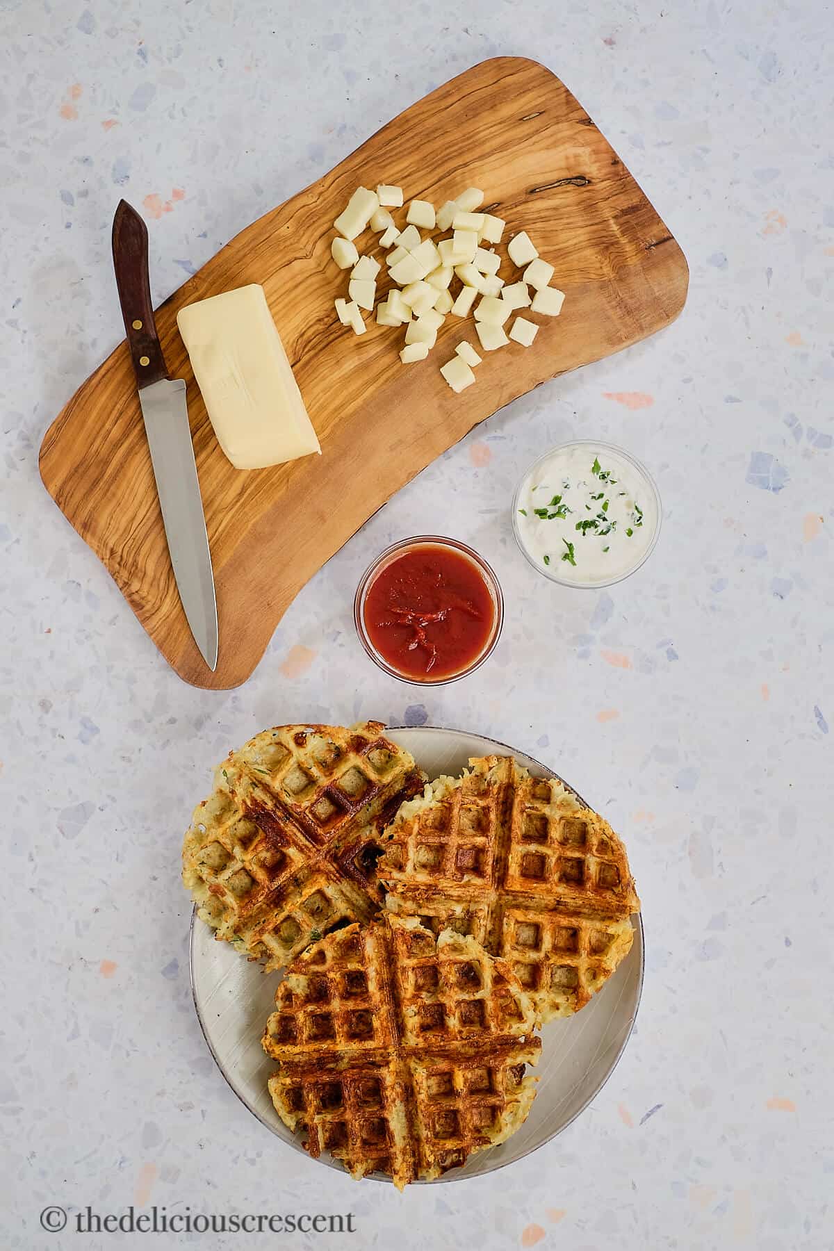 Overhead view of a savory breakfast with condiments.