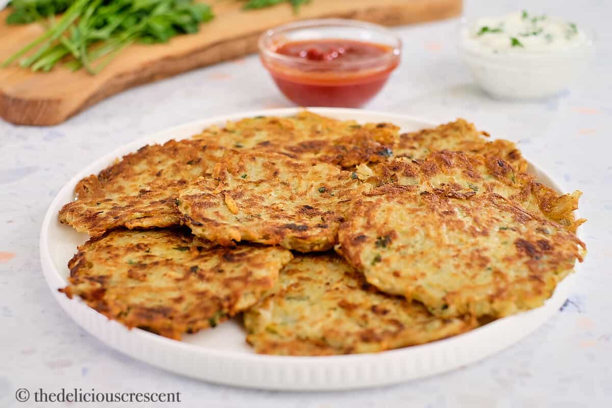 Potato pancakes in a plate placed on a table.