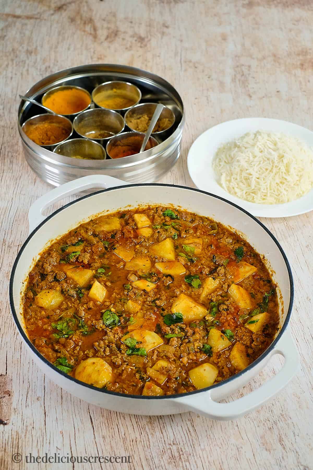 Keema curry cooked in a saute pan and served on table.