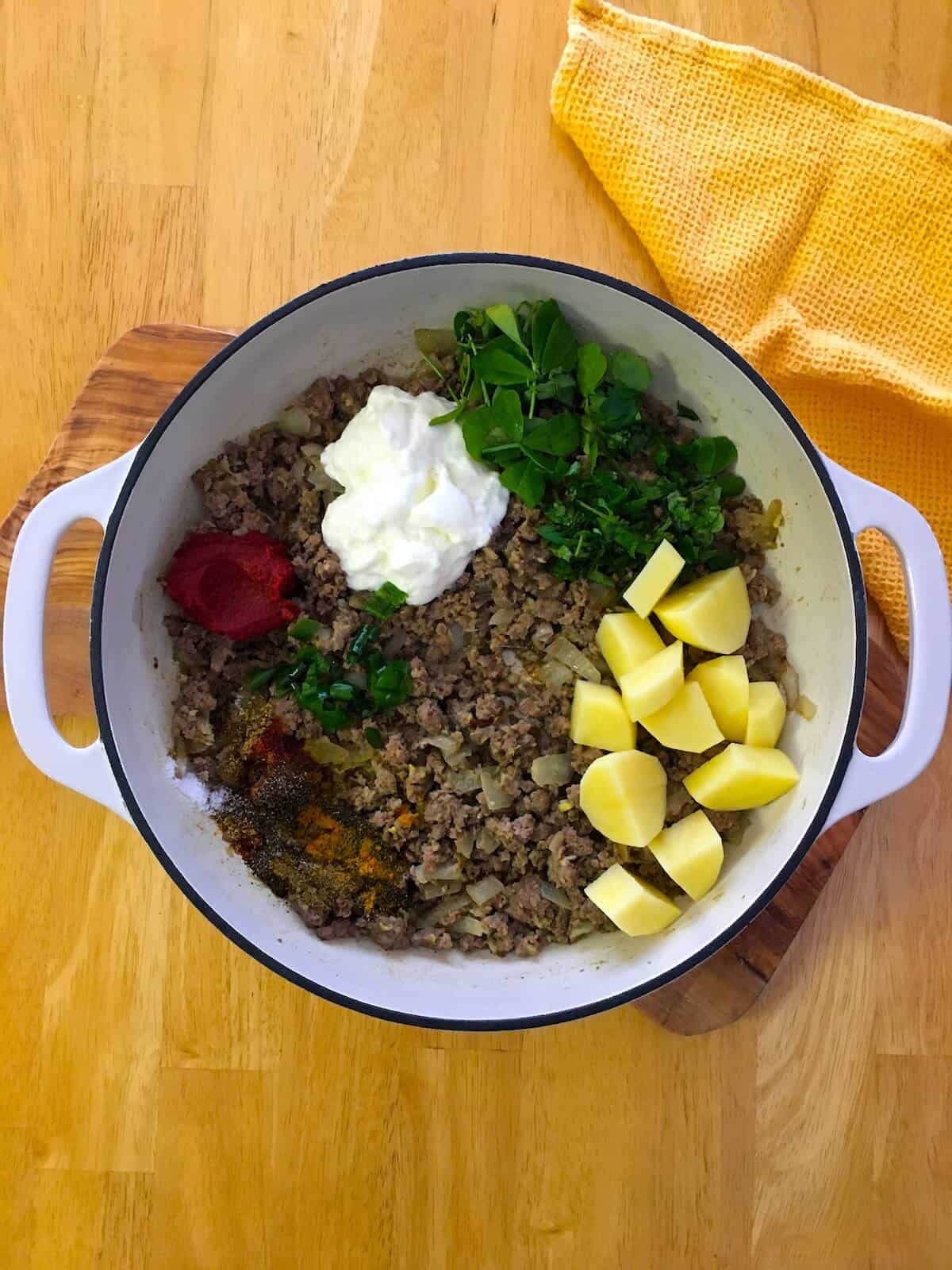 Vegetables, spices, herbs and seasonings added to ground meat.