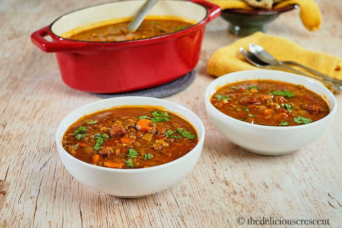 Lentil soup with sausage on the table.