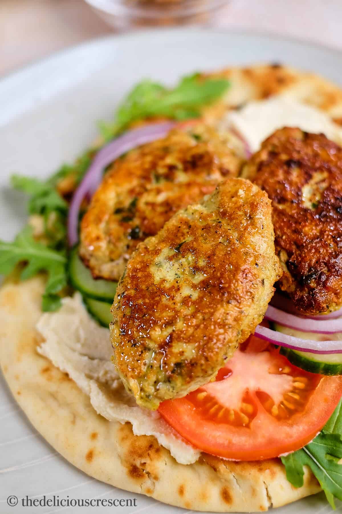 Juicy chicken koftas stacked together.