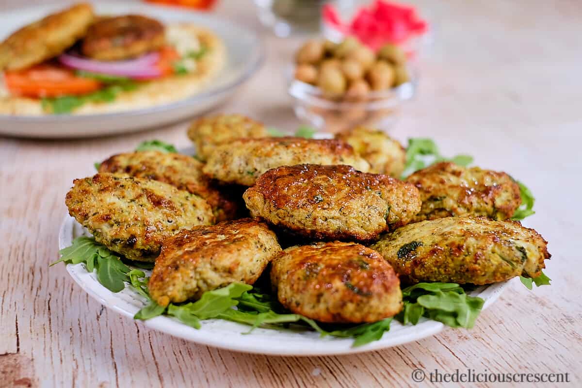 Chicken koftas arranged in a white plate.