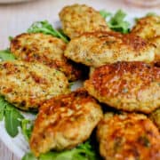 Close up of chicken kofta arranged on a plate.