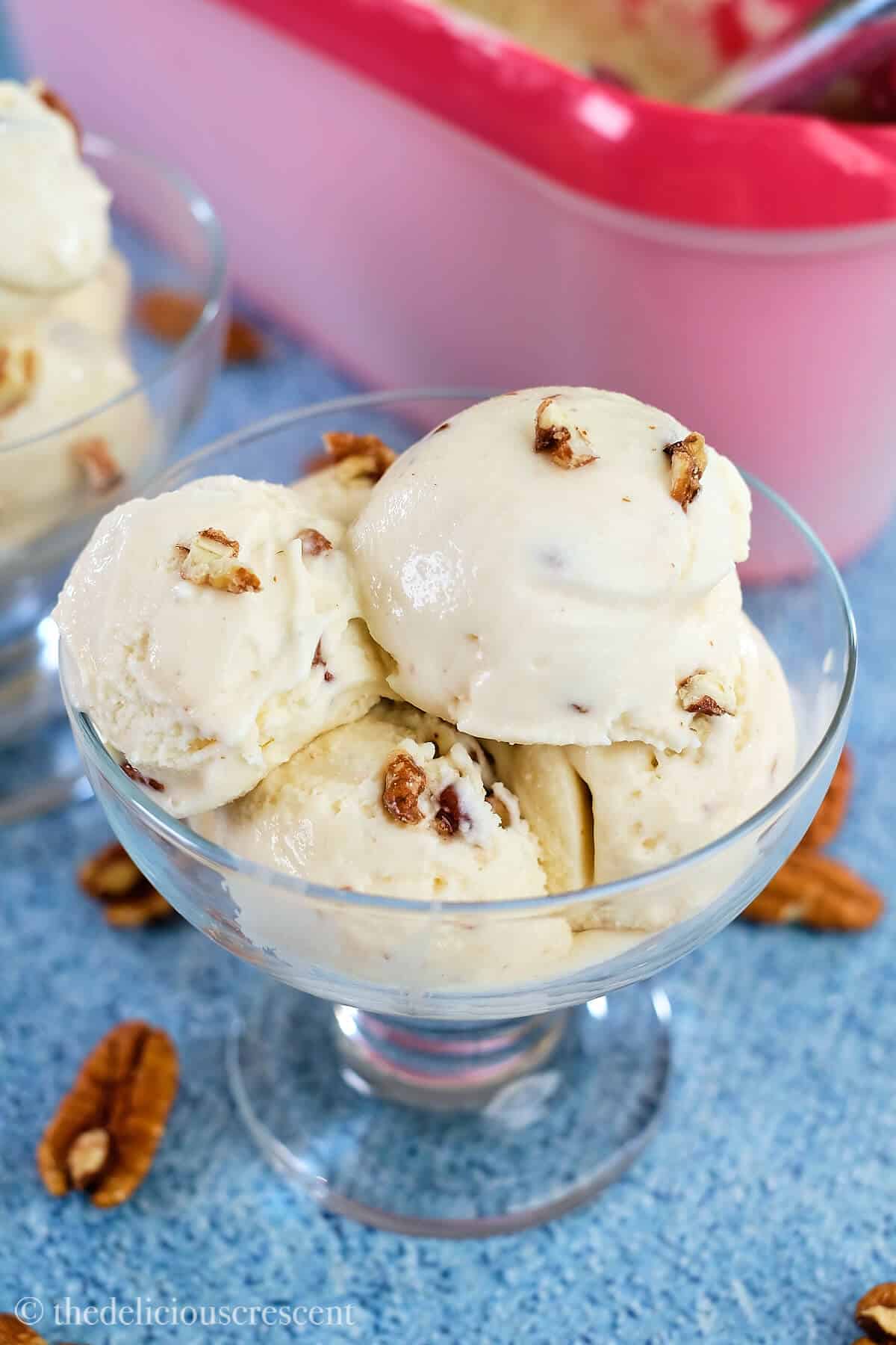 Maple pecan ice cream in a glass bowl.