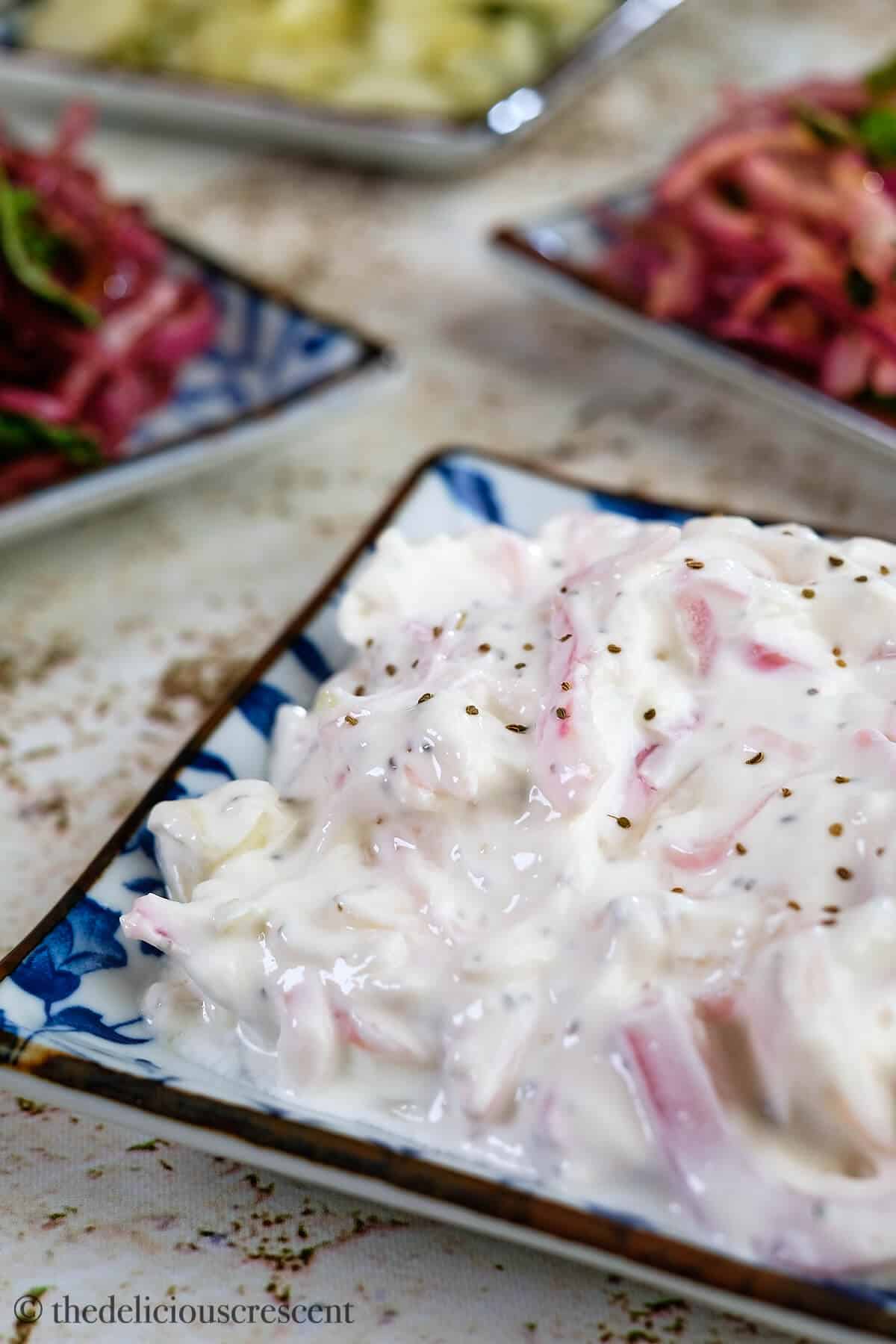 Creamy onion salad in a plate.