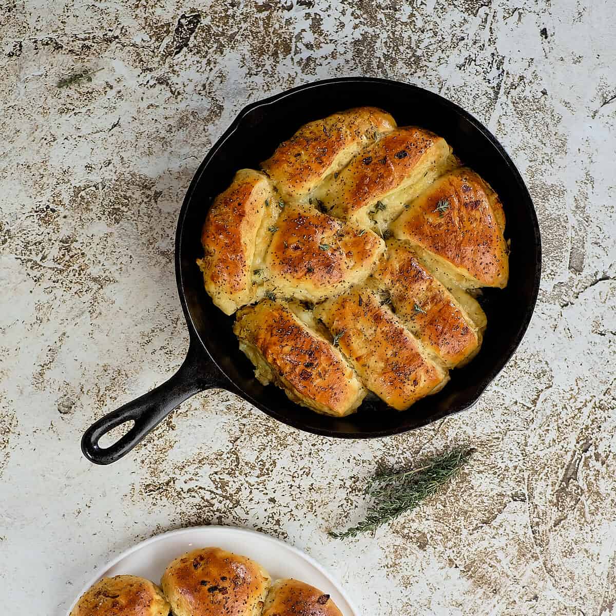 French onion rolls filled with cheese and baked in a skillet.