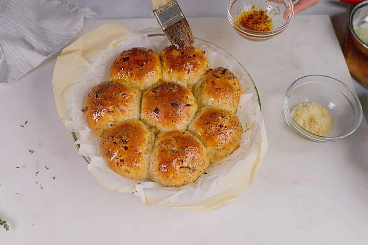 Brushing oil on baked bread.