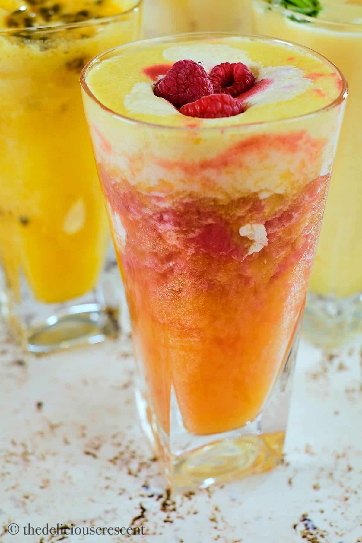 Colorful fruit beverage in a tall glass.