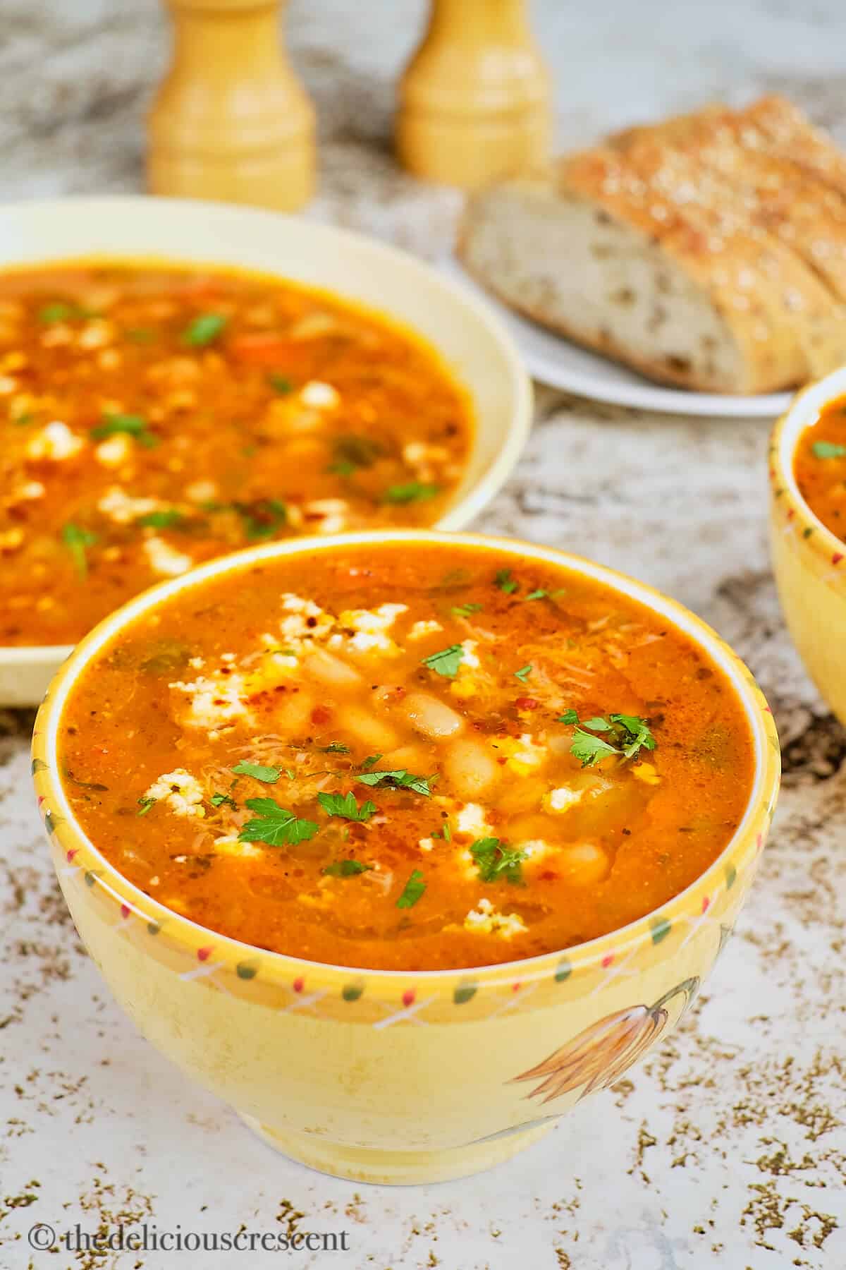 A bowl full of mediterranean white bean soup.