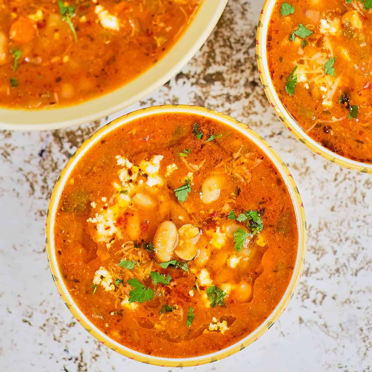 Close view of white bean soup served on the table.