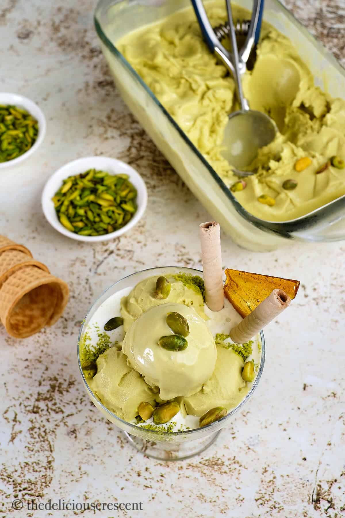 Nutty ice cream in a serving bowl and in a glass dish.
