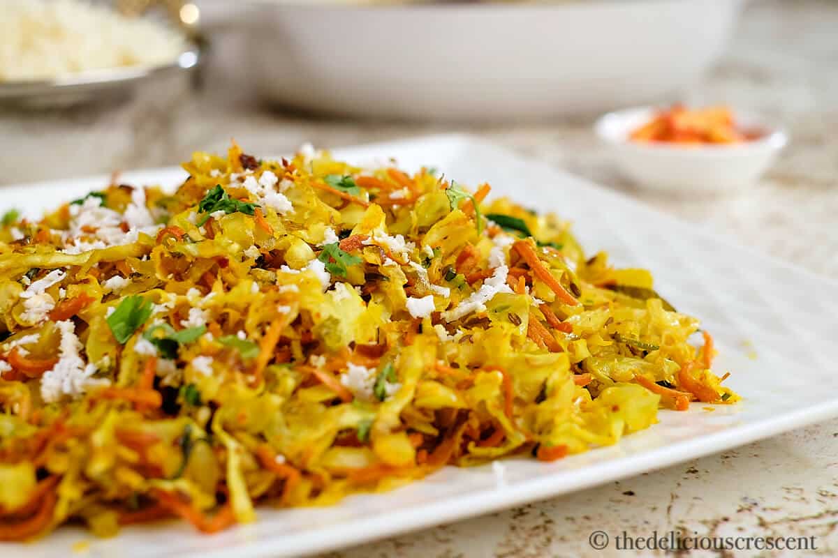 Indian roasted cabbage poriyal in a plate on the table.