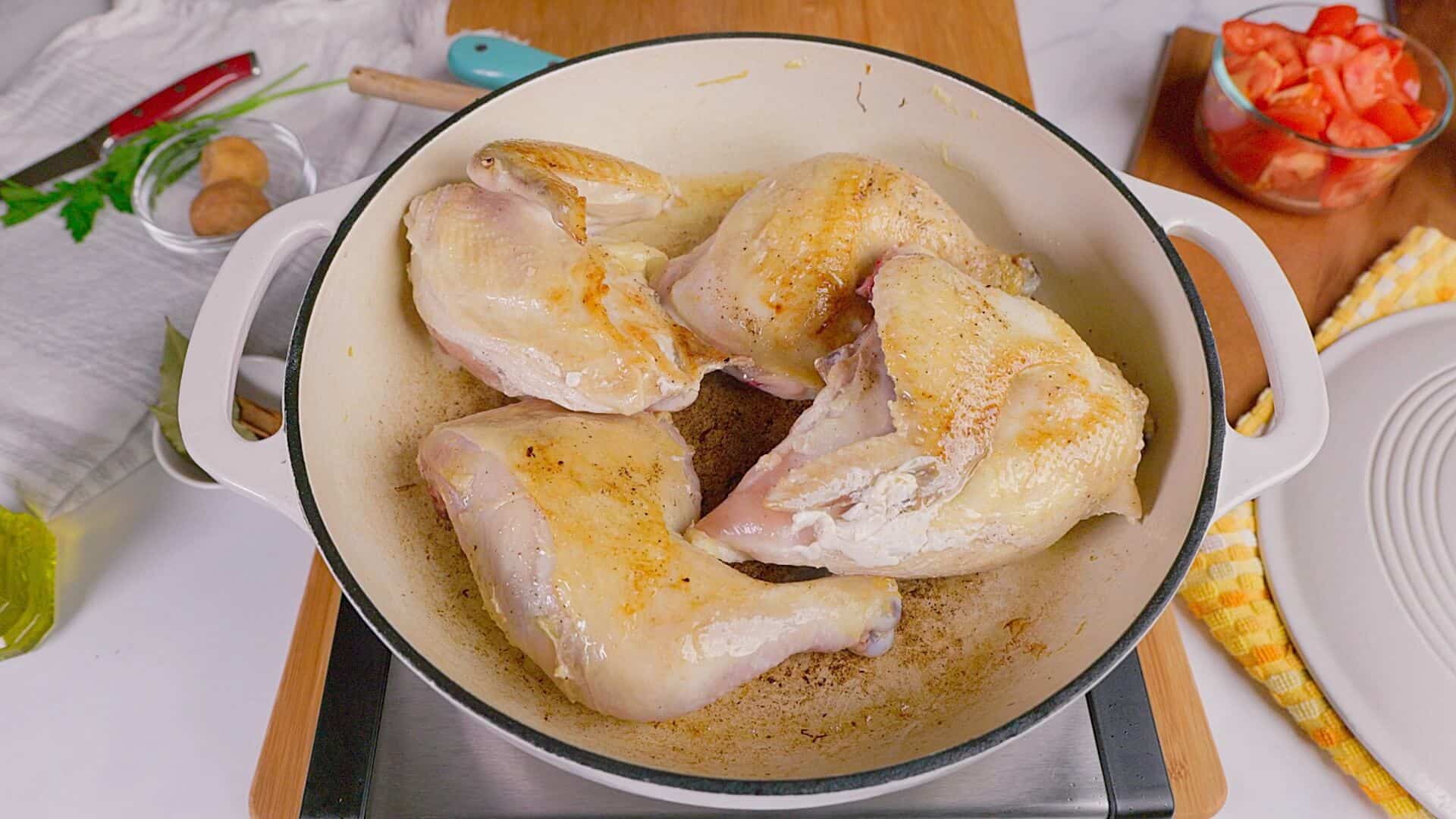 Searing chicken for the recipe.