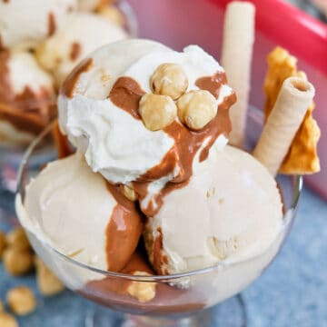 Close view of hazelnut gelato served with toppings.
