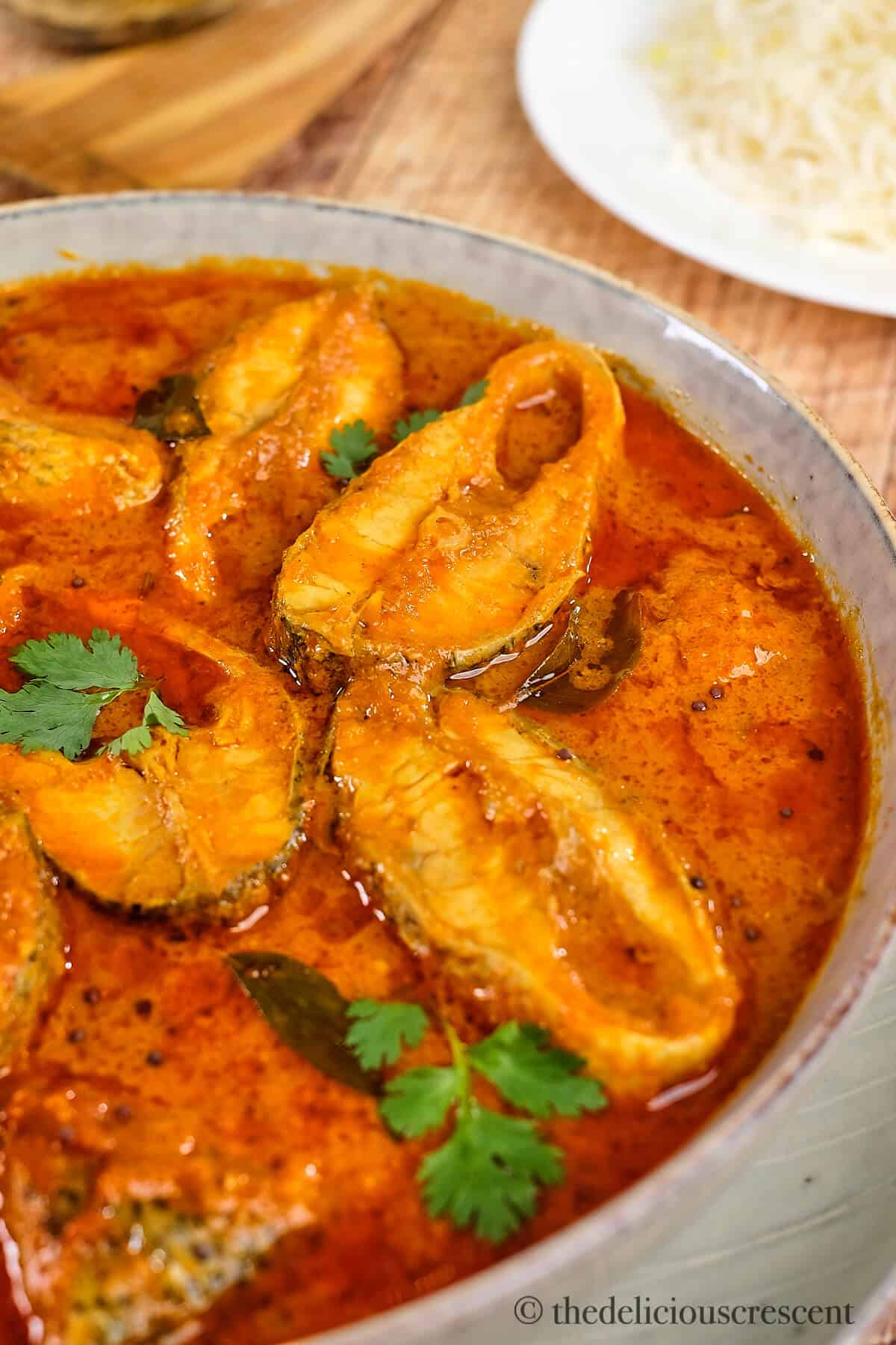 Indian fish curry with coconut based sauce in a bowl.