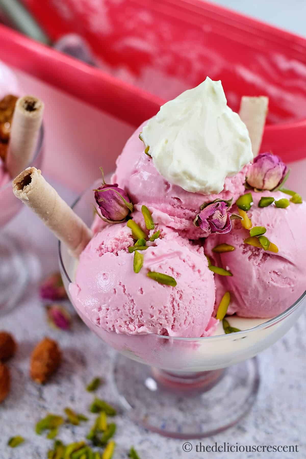 Scoops of rose ice cream in a bowl.