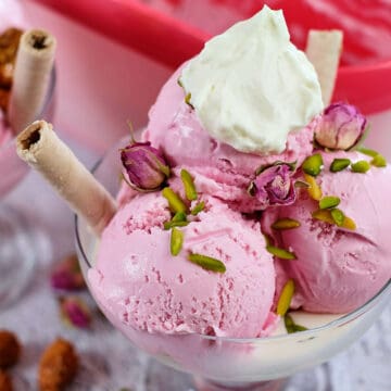 Close view of rose ice cream in a bowl.