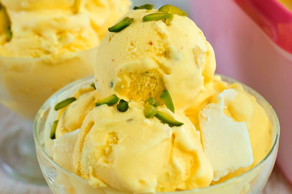 Saffron ice cream in a glass cup.