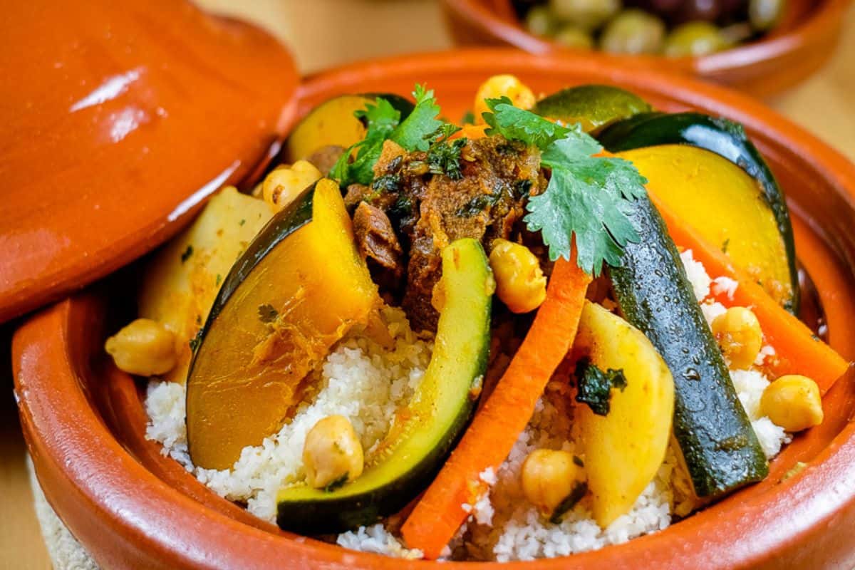 Moroccan lamb stew with vegetables over couscous.