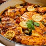 Close view of Morccan fish tagine served in a white dish.