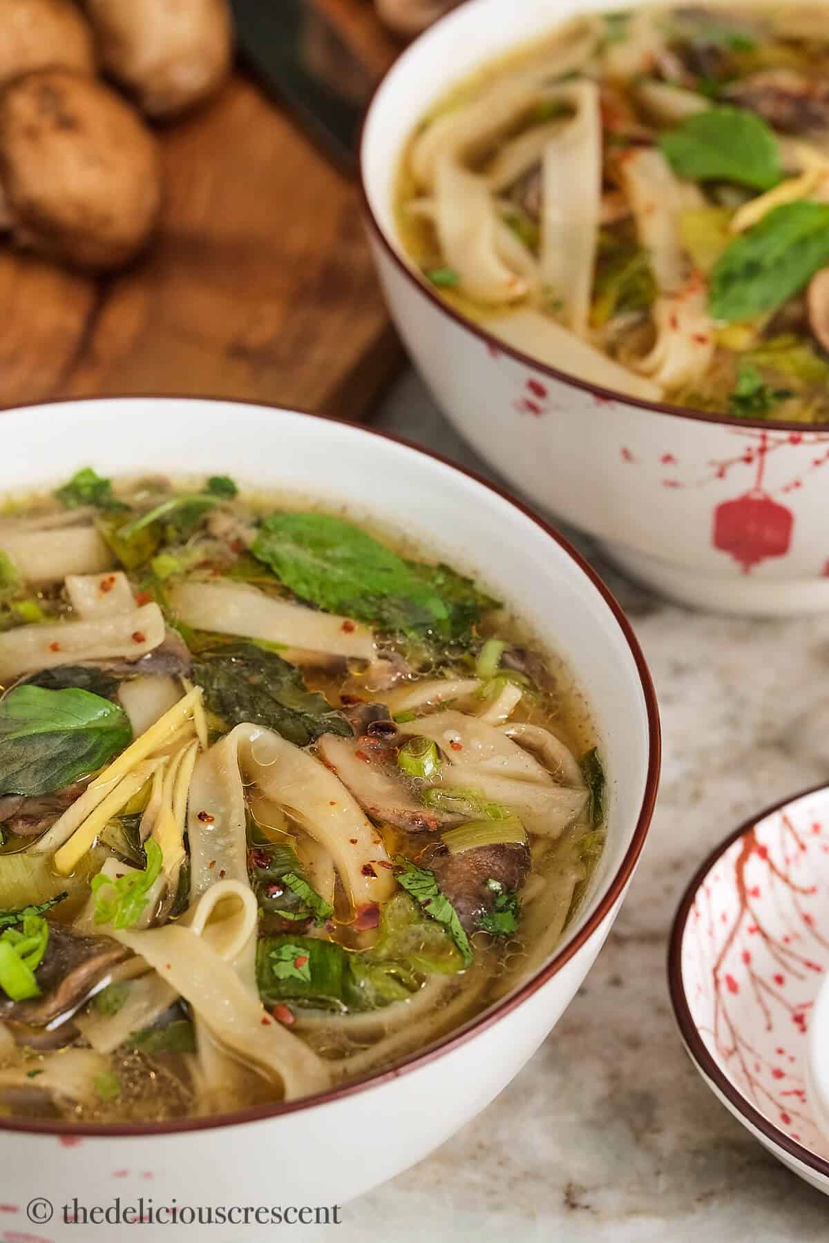 Asian noodle soup served in a white bowl.