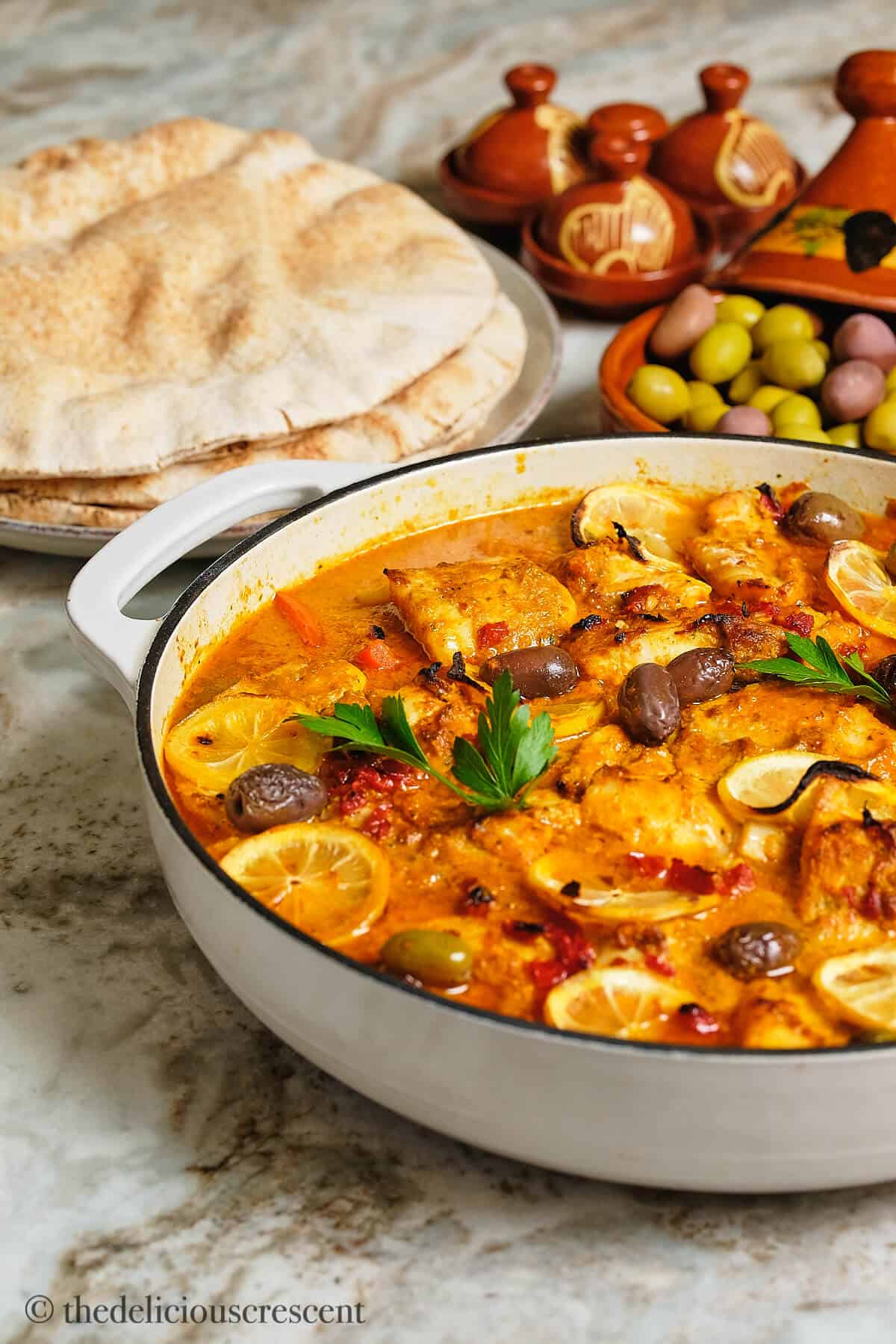 Front view of fish with chermoula sauce.